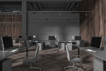 Modern grey office workspace interior with pc desktop and armchairs in row