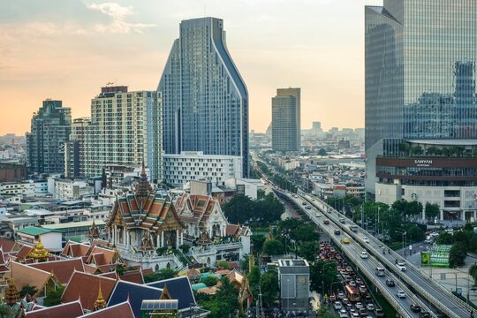 An aerial, elevated view of Silom including Wat Hua Lamphong (a Buddhist temple) and Samyan Mitrtown as seen from Montien Surawong Hotel - Bang Rak, Bangkok, Thailand