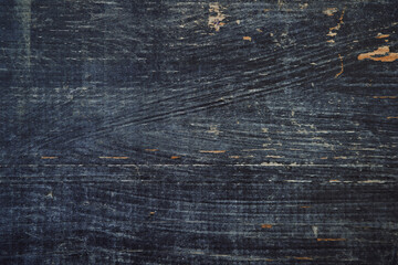 Wooden surface with peeling black paint