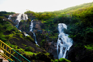 A breathtaking view of Dudhsagar Waterfall during the rainy season, a stunning display of cascading beauty.