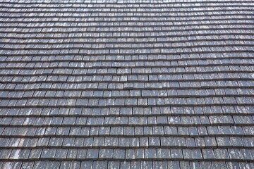 Wood shingles on roof, background.