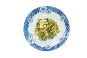 fried slice Chinese pickled cabbage with egg in soy sauce on dish