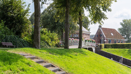 Bridge with flowers over the canal in the Dutch town of Dokkum in Friesland.