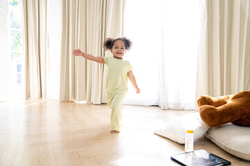 Fototapeta na wymiar African American little girl is Having Fun In the playroom at Home