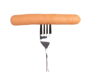 fork with tasty cooked sausage