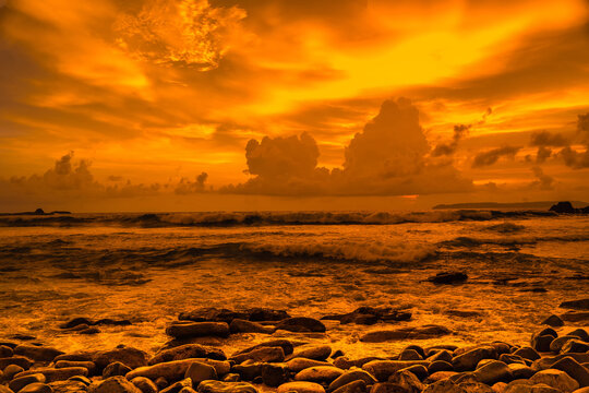 Sunset at the rocky beach in Papuma, Jember, East Java, Indonesia