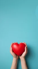 Fotobehang The essence of love with hands presenting a red heart on a serene blue background, an eloquent symbol of affection. Generative AI. © Surachetsh