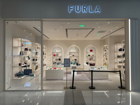 Shanghai,China-Dec.28th 2023: front of Furla retail store. Luxury handbags in store