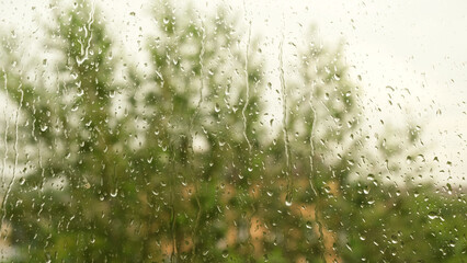 Drops of summer rain on glass. Sad weather