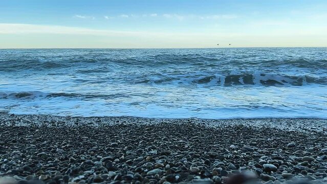 sea surf on a pebble super slow-motion video 240 fps
