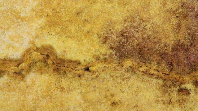 Sulfur stream after rare raine, dropped, supersaturated solutions, chemical fluvial sediments, Mountains of volcanic origin. Hormuz Island, Iran