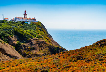 Stunning landscape with Cabo da Roca lighthouse overlooking the promontory towards the Atlantic Ocean, Portugal