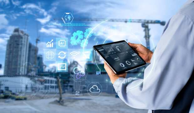 Smart Construction Project management system concept.Hands using digital tablet with Construction Management Software on blurred construction site as background