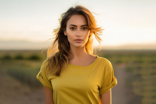 Beautiful woman with yellow t-shirt on nature background on the outskirts of the city, Brazilian woman.