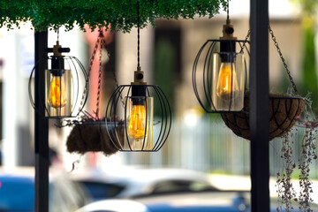 Decorative lantern hanging on the street of a modern city