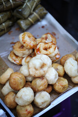 Mote Lat Kaut or fried sticky rice doughnut Burmese snack for teatime table selling in Burma Market in Prakanong Thailand