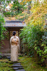 Japanese Female Kimono Portrait photography. Kyoto, Japan. Japanese traditional buildings background.