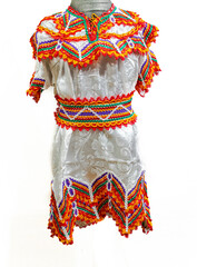 A traditional Algerian kabyle dress in white isolated on a white background. Flower patterns with petals,wave embroidery in different colors, red, yellow, green, purple, white and orange threads.