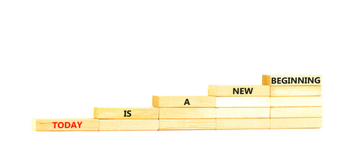 Today is a new beginning symbol. Concept words Today is a new beginning on wooden blocks stairs....