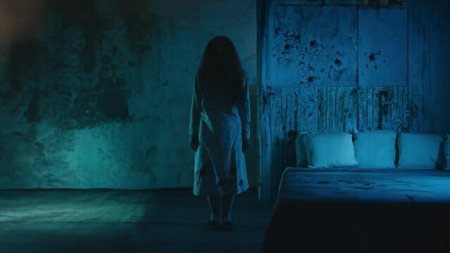 Creepy ghost of female killer in nightgown standing in a haunted house, horror