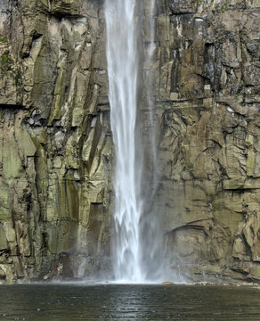 water flowing from a waterfall at Taughannock Falls State Park (cascade, cayuga lake near ithaca, upstate new york) finger lakes region in autumn, fall