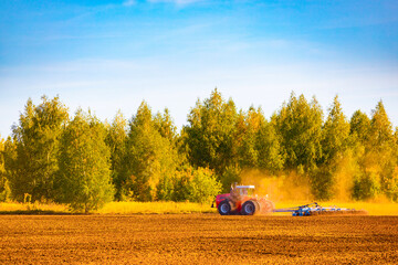 Ryazan, Russia - September 17, 2023: red tractor in the field.