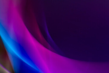Abstract background with colored lines and blur effect of purple and blue colors. Gradients, waves and twisting.