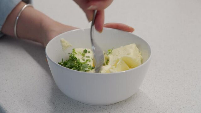 making compound butter for turkey with traditional Thanksgiving flavors like parsley and garlic