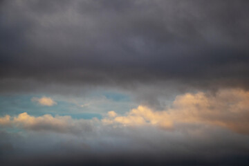 Dark stormy sky during sunset at dusk