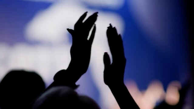 Clapping hands on a light background. Delayed action. 4k resolution. Close-up of women's hands.