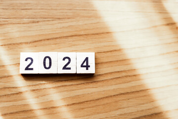 2024 on wooden block on the wood table. Happy New Year 2024. Planning and Goal concept. copy space