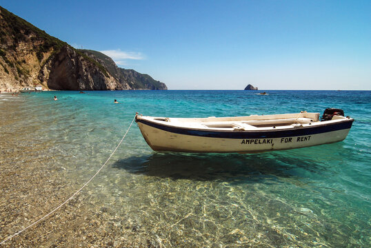 Corfu Island, Greece - June 9, 2008: Boat on Chomi beach known as Paradise beach near Palaiokastritsa village on Corfu Island