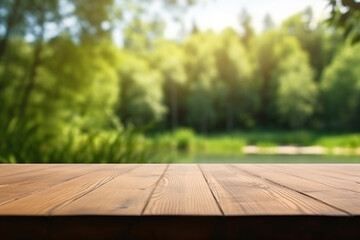 The empty wooden table top with blur background of summer lakes green forest