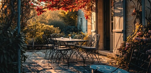 a dining table with chairs outside on a patio