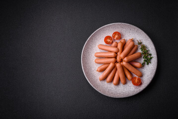 Delicious small sausages with salt, spices and herbs