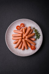 Delicious small sausages with salt, spices and herbs