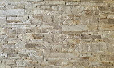 Stone cladding wall made of natural rocks with shades between white, brown and gray. Background and...