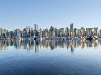 Skyline of Vancouver as seen from Stanley Park during a golden hour evening in the fall in British...