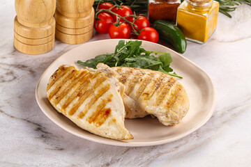 Grilled chicken breast served arugula