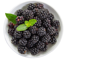 Blackberries in a bowl isolated on transparent background. Top view.