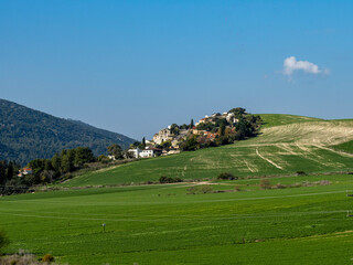 Fototapeta na wymiar landscape with mountains and blue sky, Farming Fields in North Israel . Kiryat Tiv'on 