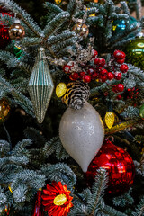 Close up of ornaments on a Christmas tree at a conservatory in Pennsylvania. Red and white decorations.