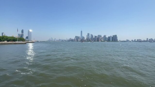 Sailing in New York Bay with the Big Apple skyline in the background, on a sunny, blue Manhattan day.