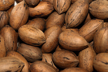 Pecans closed whole nuts pile background texture