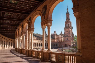 Photo sur Plexiglas Europe du nord The Plaza de España galleries lited up with evening sunlight making magic shadows. North tower view on Spain Square, Andalusia, South Spain.
