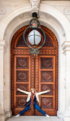 Beautiful Woman, a tourist, in the front of the Wood Gate in the Parliament House is the meeting...
