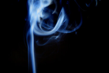 real blue cigarette smoke on a black background