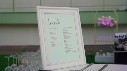 Menu in outdoors vacation bar of cocktails and alcohol drinks. Welcome drink at a celebration or wedding reception in a restaurant or vacation bar. Alcoholic Beverage.