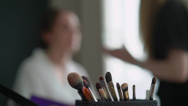 A close-up of a group of brushes for make up. Makeup artist tools. Beauty industry, decorative cosmetics and fashion. MUA.