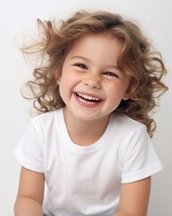Laughing toddler in white t-shirt